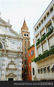 Low angle view of the bell tower and a church, Venice, Italy