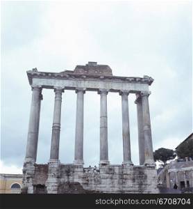 Low angle view of the columns of a monument, Roman Forum, Rome, Italy