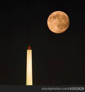 Low angle view of the moon above a tower, Washington Monument, Washington DC, USA
