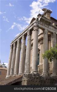 Low angle view of the old ruins of a temple, Faustina Temple, Rome, Italy