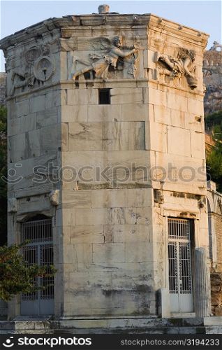 Low angle view of the old ruins of a tower, Tower Of The Winds, Roman Agora, Athens, Greece