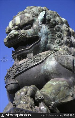 Low angle view of the statue of a lion, Forbidden City, Beijing, China