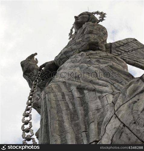 Low angle view of the statue of winged Virgin Mary of Quito, El Panecillo Hill, Quito, Ecuador