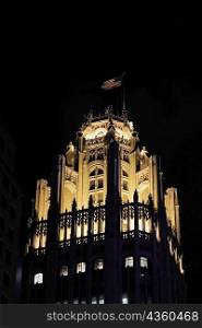 Low angle view of tower at night, Tribune Tower, Chicago, Illinois, USA