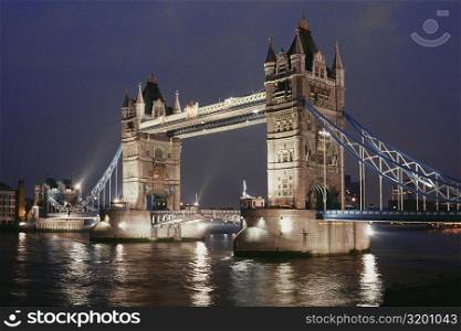 Low angle view of Tower bridge at night, London, England