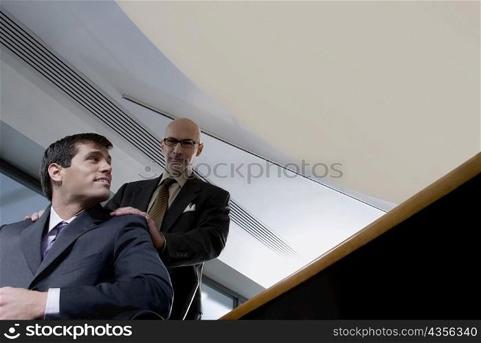 Low angle view of two businessmen in an office