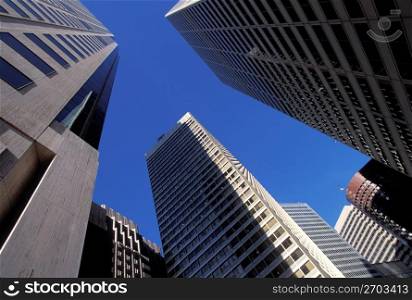 Low angle view of urban buildings in business district