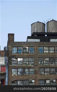 Low angle view of water tanks on an apartment building