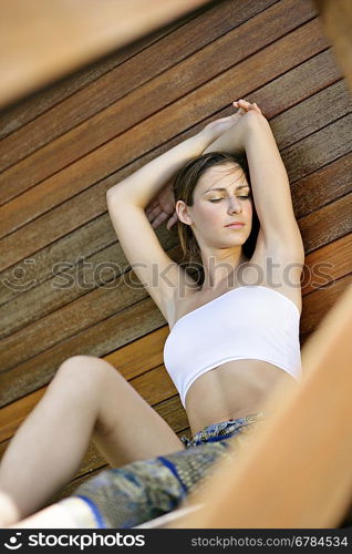 Low angle view of young woman sitting