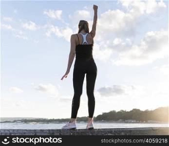 low angle woman standing victorious way