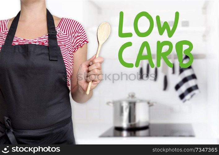 low carb cook holding wooden spoon background concept.. low carb cook holding wooden spoon background concept