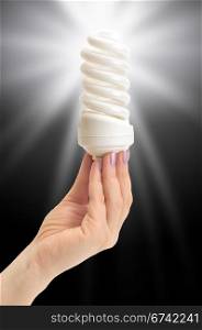 low-energy bulb in hand