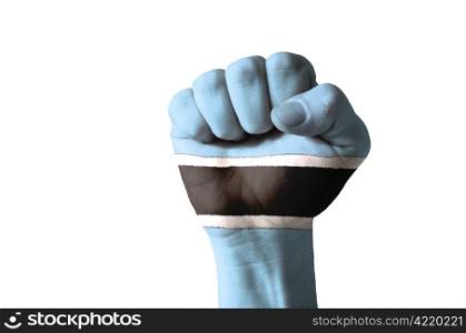 Low key picture of a fist painted in colors of botswana flag