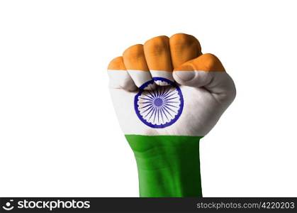 Low key picture of a fist painted in colors of india flag