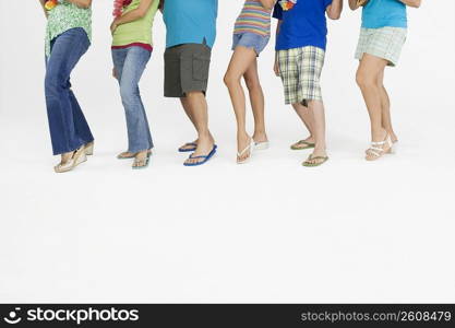 Low section view of a group of people dancing in a row