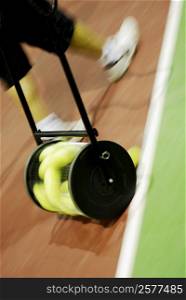 Low section view of a person walking on a tennis court