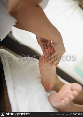 Low section view of a woman getting spa treatment