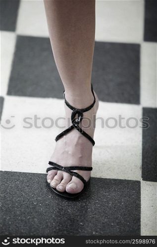 Low section view of a woman wearing a sandal
