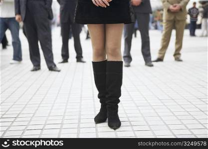 Low section view of a woman wearing boots