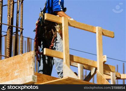 Low section view of a worker at a construction site, Miami, Florida, USA