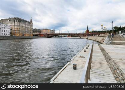 low view of Moskva River and Moskvoretskaya Embankment in Moscow city in autumn