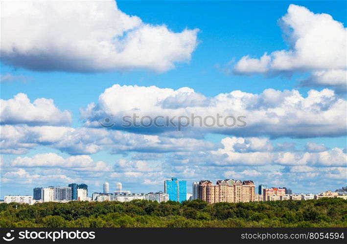 low white clouds in blue sky over city in summer day, Moscow