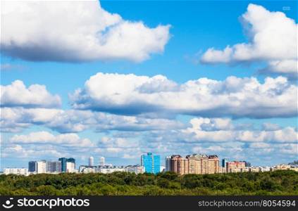 low white clouds in blue sky over city in summer day, Moscow