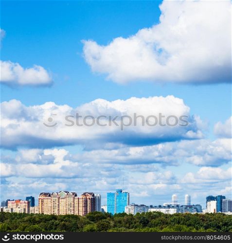 low white clouds in blue sky over town in summer day, Moscow