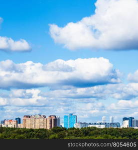 low white clouds in blue sky over town in summer day, Moscow