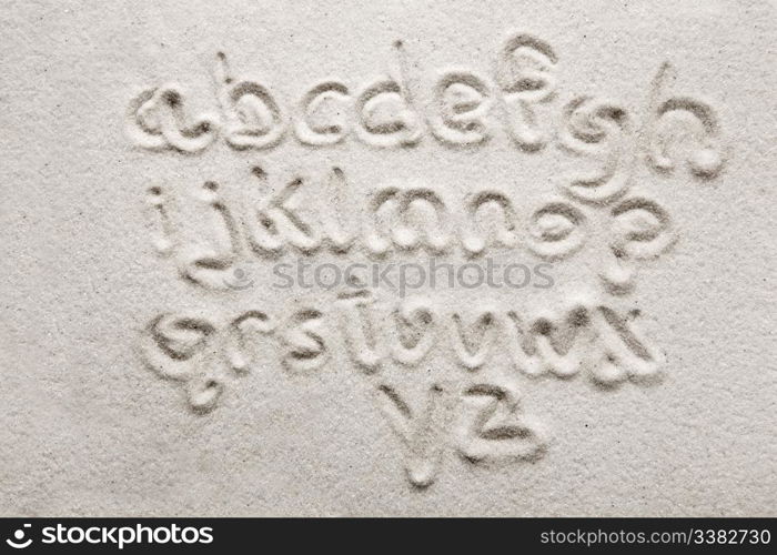 lower case alphabet written in sand - a designers tool