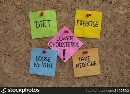 lower cholesterol concept - healthy diet, exercise, losing weight, taking medicine, presented with sticky notes on cork bulleting board