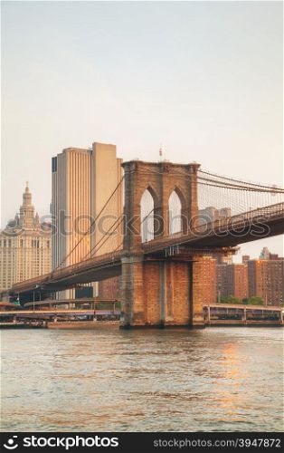 Lower Manhattan cityscape with the Brooklyn bridge in the evening