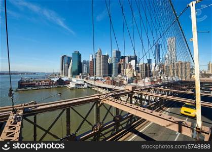 Lower Manhattan skyline view from Brooklyn Bridge in New York City. No brandnames or copyright objects.