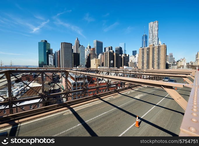 Lower Manhattan skyline view from Brooklyn Bridge in New York City