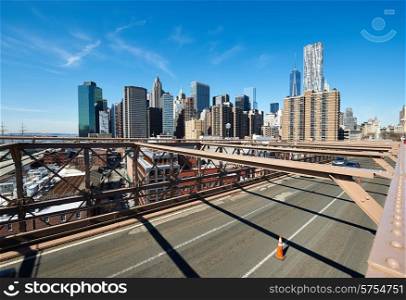 Lower Manhattan skyline view from Brooklyn Bridge in New York City