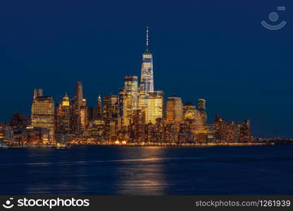 Lower Manhattan which is a apart of New york cityscape river side which can see One world trade center at twilight time, USA, Taking from New Jersey