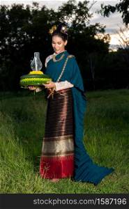 Loy Krathong Traditional Festival,Beautiful woman in thai dress traditional hold kratong.