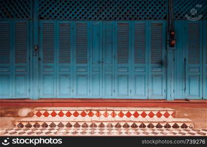 Luang Prabang, Laos - blue door French Colonial building with street balcony on main street - Famous old historic attraction and photo spot