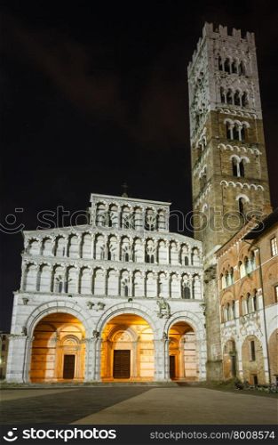 Lucca (Tuscany, central Italy) city night view. The facade and bell tower of Lucca Cathedral of Saint Martin. Build in 1063.