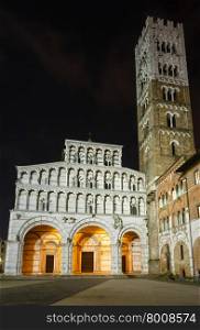 Lucca (Tuscany, central Italy) city night view. The facade and bell tower of Lucca Cathedral of Saint Martin. Build in 1063.