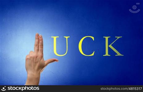 Luck concept. Luck word and fingers instead of letter L