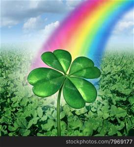 Luck concept with a four leaf clover over a field of green clovers with a rainbow from the sky shinning down as a symbol of good fortune and prosperity as a metaphore for success and opportunity.