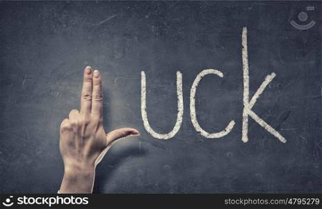 Luck word. Luck word and fingers instead of letter L