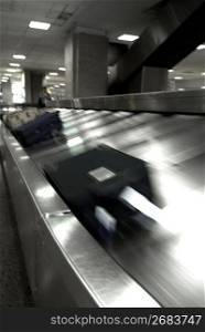 Luggage moving on conveyor belt