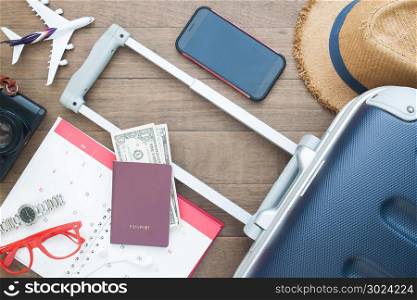 Luggage suitcase, passport, money and mobile phone, Go on board, Travel holiday concept, Flat lay