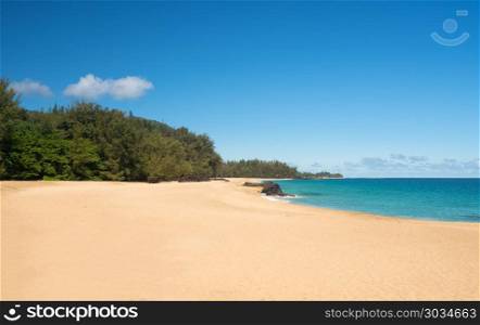 Lumahai Beach Kauai on calm day. Golden sands with warm turquoise ocean off Lumahai Beach in Kauai in Hawaiian islands. Lumahai Beach Kauai on calm day