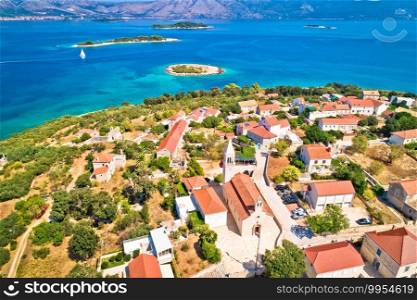 Lumbarda. Korcula island vllage of Lumbarda church and coastline aerial view, southern Dalmatia, Croatia 