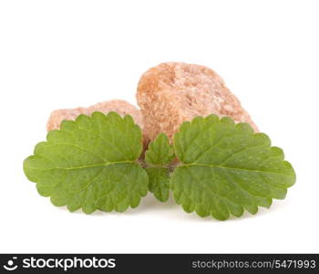 Lump brown cane sugar cubes isolated on white background