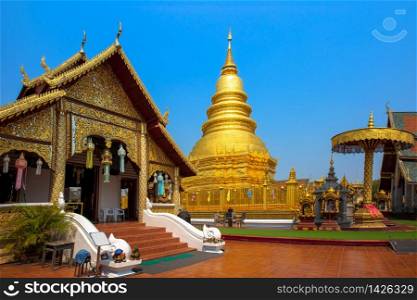 Lumphun, Thailand, 21,Feb,2020 : Landscape view of Wat Phra That Hariphunchai, Lumphun under bright blue sky background. This temple is the one important Buddhist temple in the northern Thailand