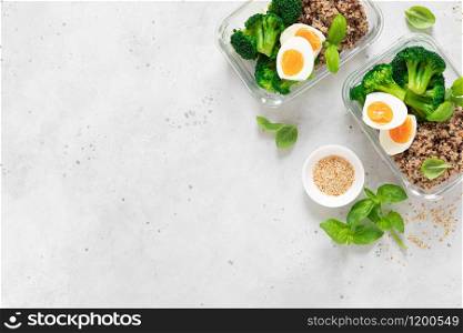 Lunch boxes with broccoli, quinoa and egg, healthy food, balanced eating concept, top view